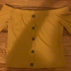 Off the shoulder top with fake buttons down the middle. Like-New/rarely worn